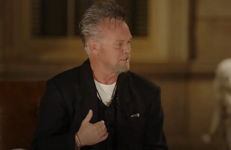 John Mellencamp engaged in conversation