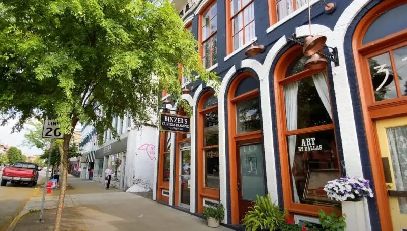 Colorful storefront with orange doors and dark accents